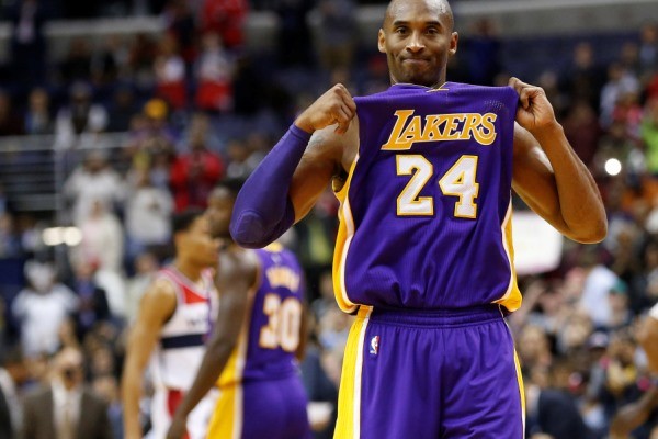 Dec 2, 2015; Washington, DC, USA; Los Angeles Lakers forward Kobe Bryant (24) gestures to the crowd while being honored during a timeout against the Washington Wizards in the first quarter at Verizon Center. Mandatory Credit: Geoff Burke-USA TODAY Sports